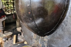 Helms and pauldrons at the forge